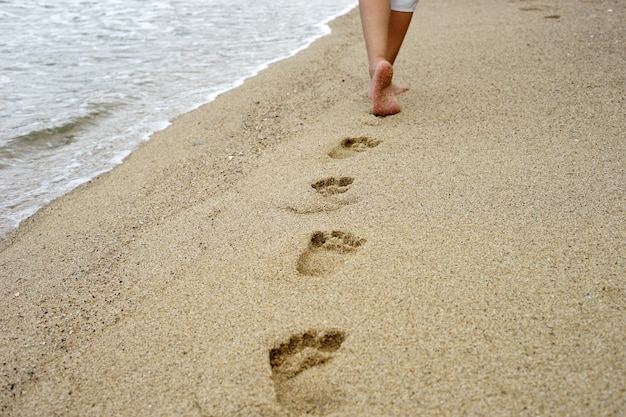 Foot prints on the beach sand