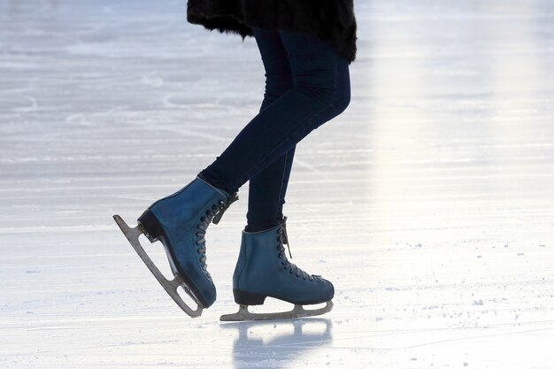 Foot skating people on the ice rink