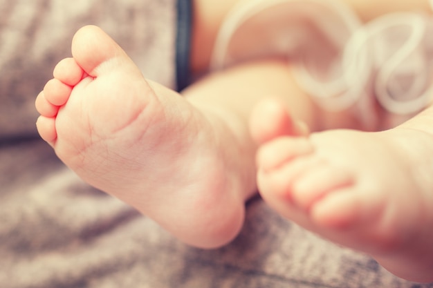 Foot of a sleeping baby close-up.