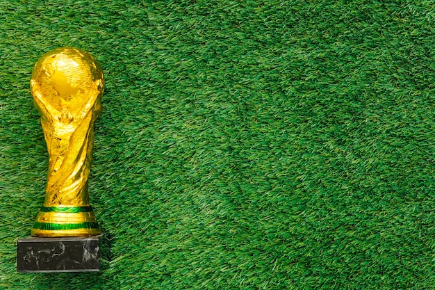 Photo football background with trophy and copyspace