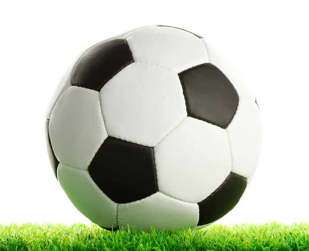 Football ball on green grass isolated on white