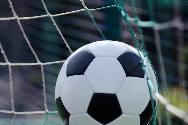 Football ball on stadium field background