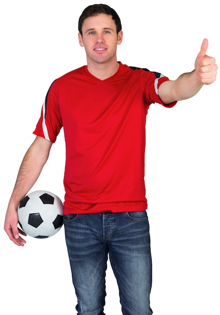 Football fan in red holding ball