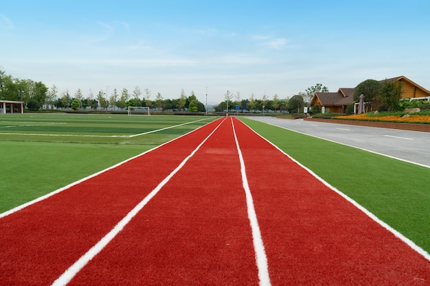 The football field and the cabin are in the park