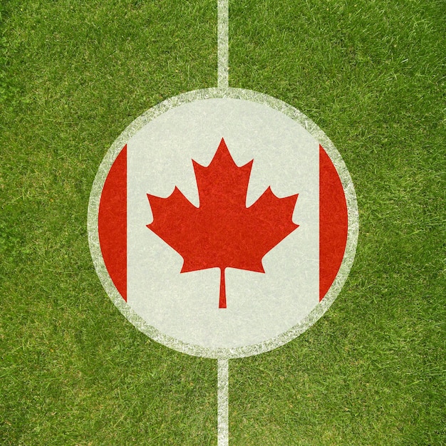 football field center closeup with canadian flag in circle