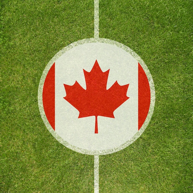 Photo football field center closeup with canadian flag in circle