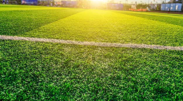 Football pitch and a cloudy sky. Green field.