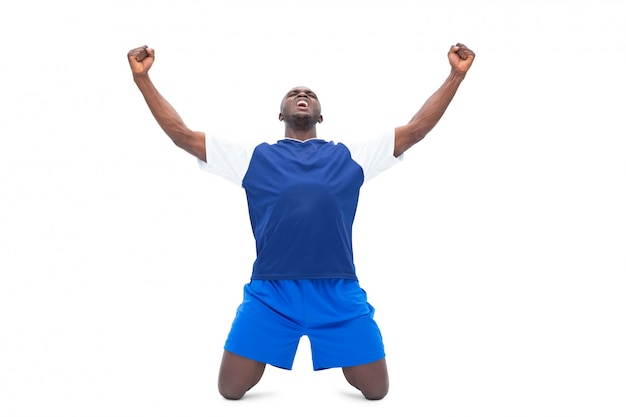 Football player in blue celebrating a win