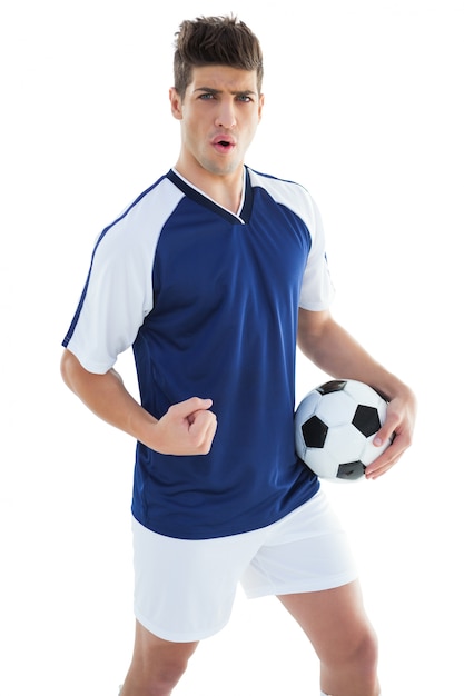 Football player in blue celebrating