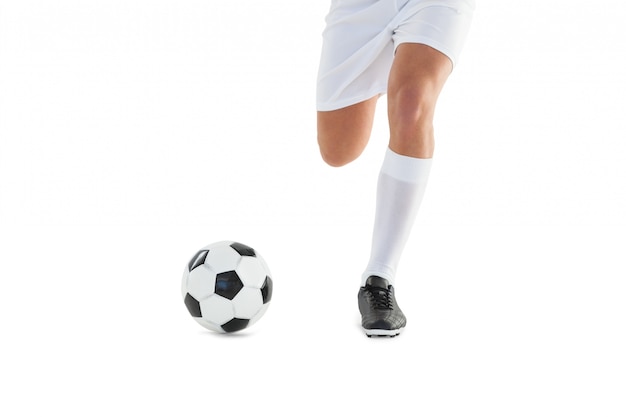 Football player kicking the ball