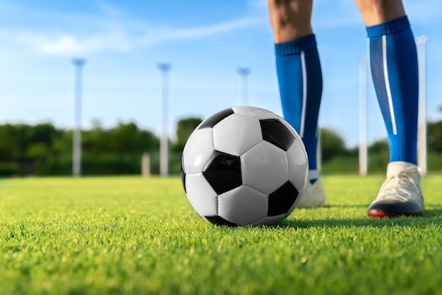 Football player set ball football at free kick point before shoot a goal in football stadium