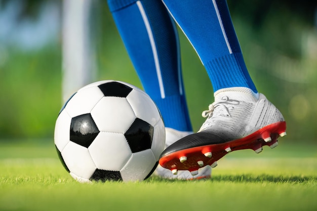 Football player set ball football at free kick point before shoot a goal in football stadium