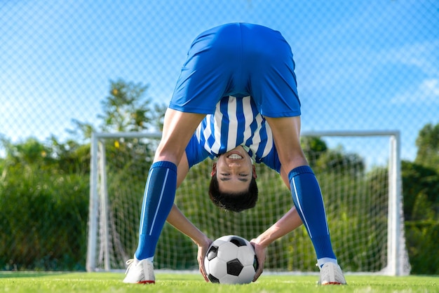 Football player set ball football at free kick point before\
shoot a goal in football stadium