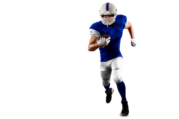 Football Player with a blue uniform Running on a white wall