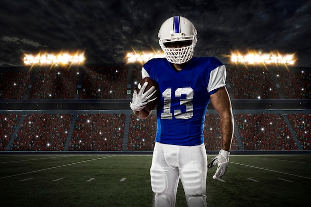 Football Player with a blue uniform on a stadium