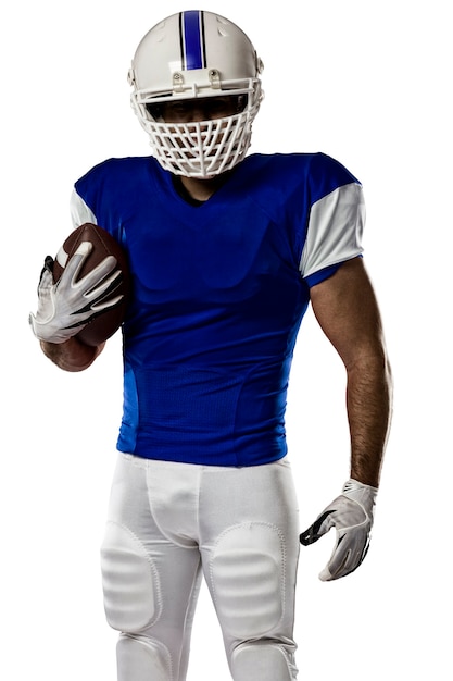 Photo football player with a blue uniform on a white wall