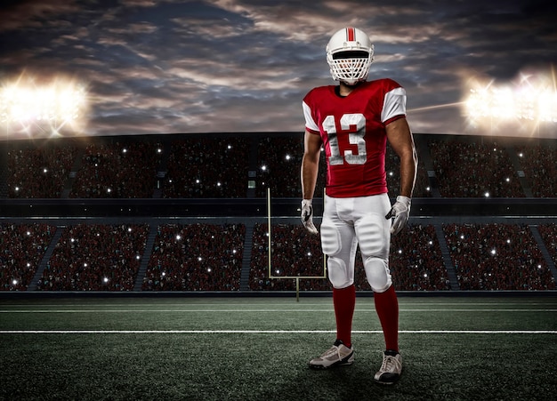 Football Player with a red uniform on a Stadium..