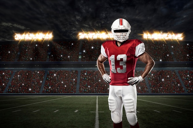 football player with a red uniform on a stadium.