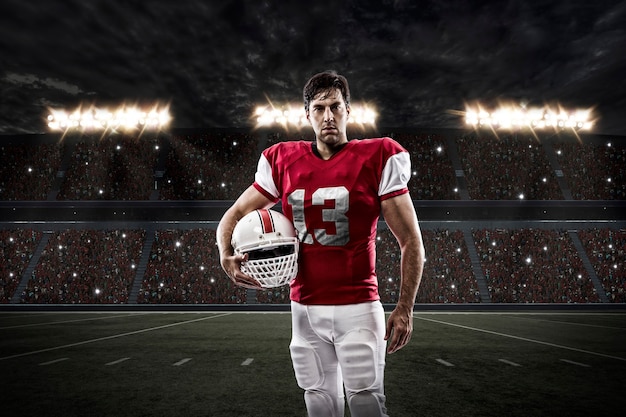 Football Player with a red uniform on a stadium.