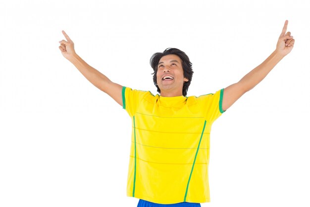 Football player in yellow celebrating a victory