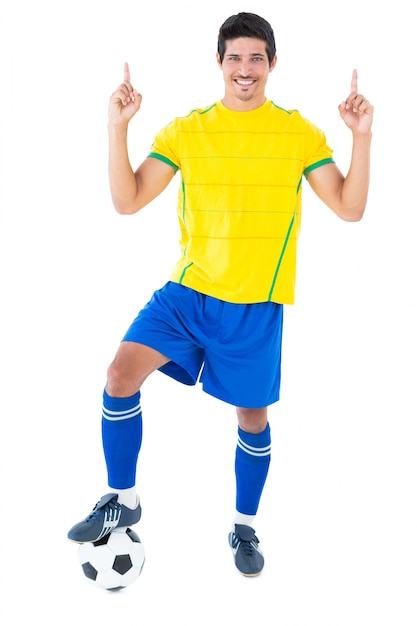 Football player in yellow with ball