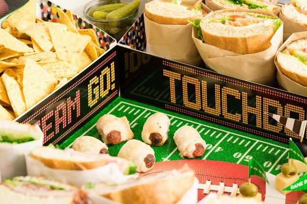 Football Snack Stadium filled with sub sandwiches, veggies and chips.