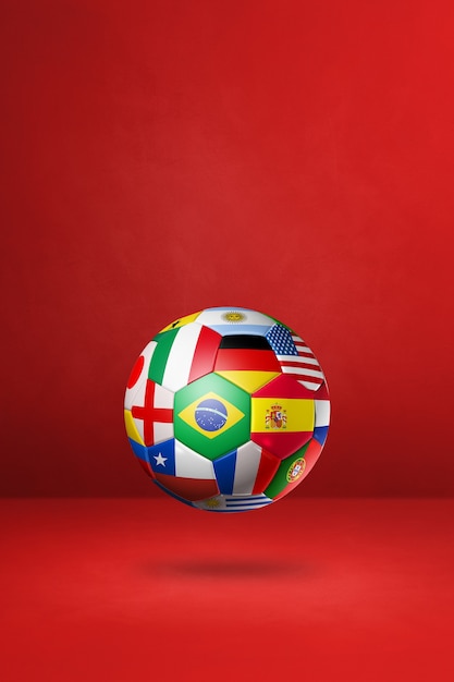 Football soccer ball with national flags isolated on a red studio background.