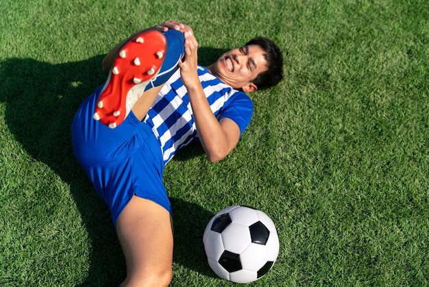 Football soccer player accident knee injury sport treatment\
champion league final match competition