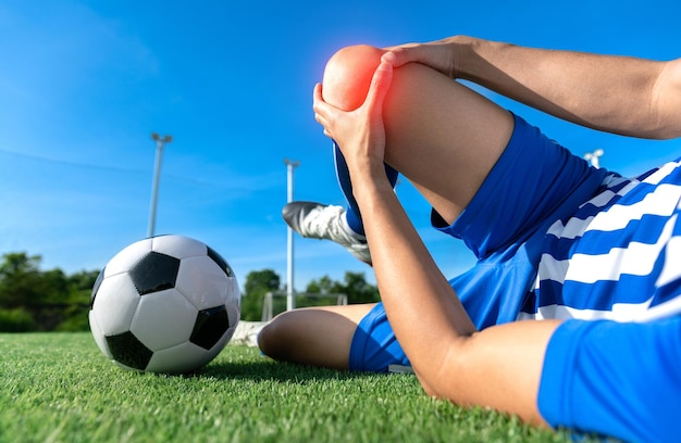 football soccer player accident knee injury sport treatment in football match at football stadium