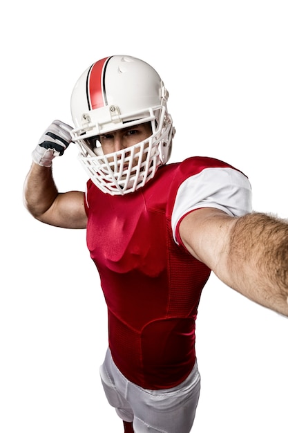 Football-speler met een rood uniform een selfie maken op wit