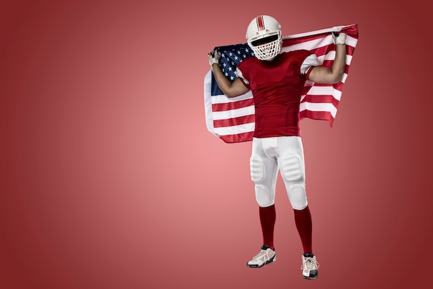 Football-speler met een rood uniform en een Amerikaanse vlag, op een rode muur