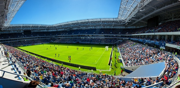 Football stadium, shiny lights, view from field. Soccer concept