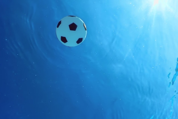 Football summer concept, football underwater, swimming pool, summer football camp