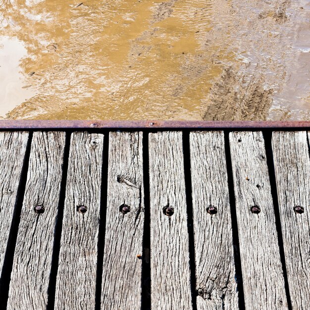 Footbridge over slushy rural road