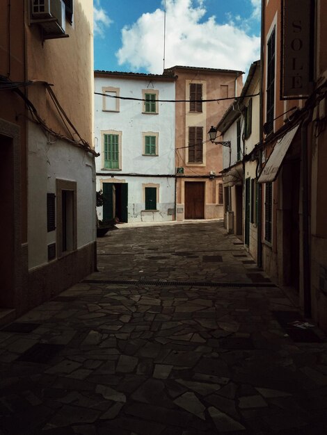 Footpath amidst buildings