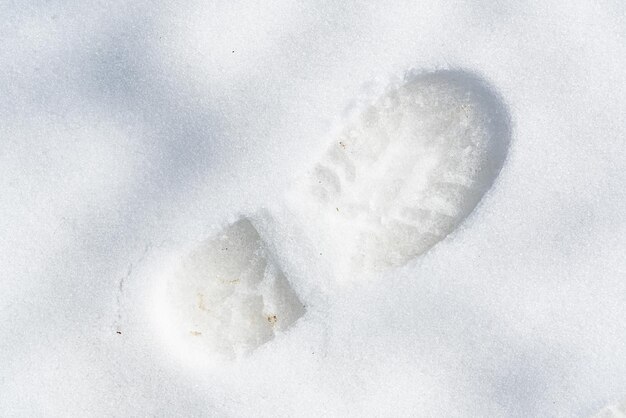 Footprint of a boot on the snow