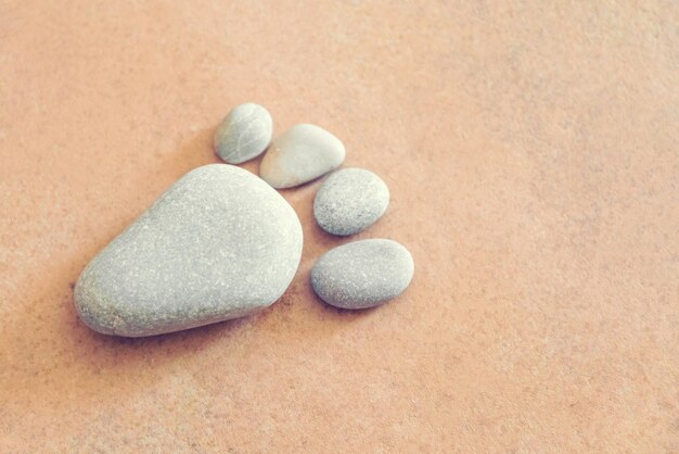 Footprint made of pebble on stone