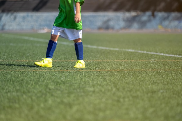 Foots of child football player