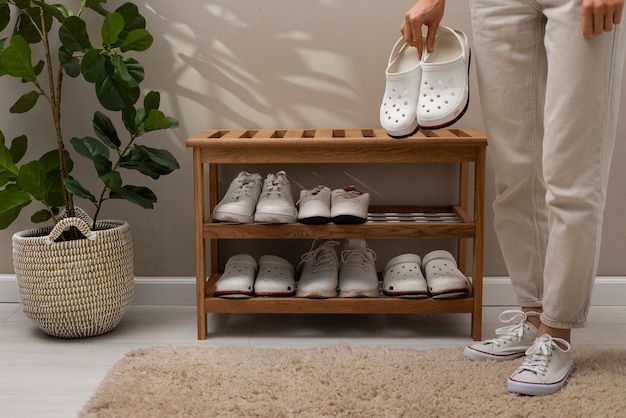 footwear stacked in shoe rack indoors