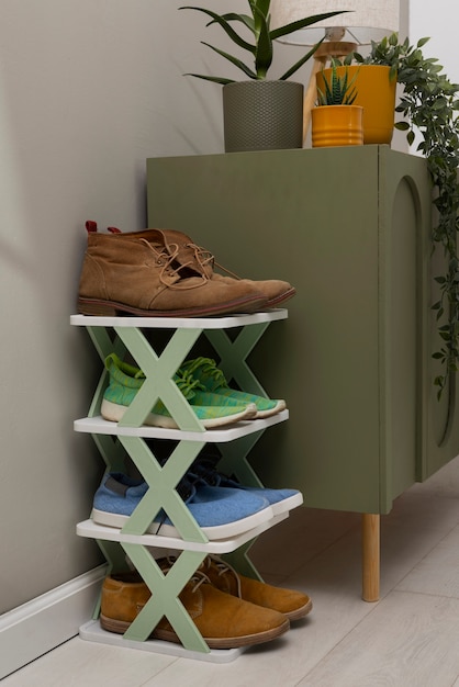 Photo footwear stacked in shoe rack indoors