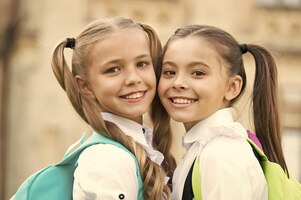For the look of the future beauty look of little children happy classmates with cute look small fashion models outdoors vogue look fashion and beauty hair salon back to school learn and study