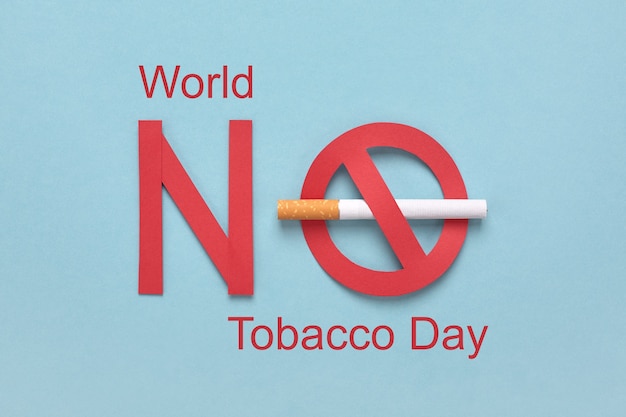 Forbidden sign with a cigarette and red text World No Tobacco Day.