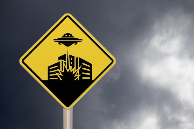 Photo forbidden sign with a ufo destroying a city drawn in the middle