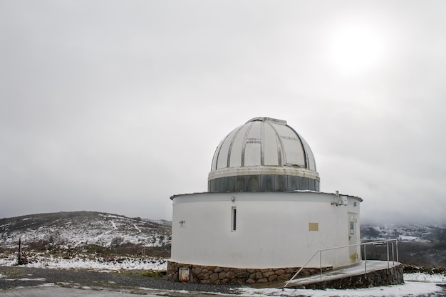 Forcarei Astronomical Observatory in the middle of the snowy mountain.