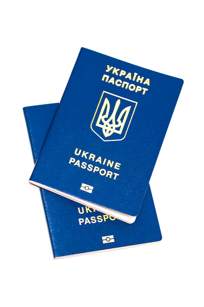 Загранпаспорт Украины на белом фоне. Украинский путешественник. Украинский мигрант. Безвизовый режим для Украины