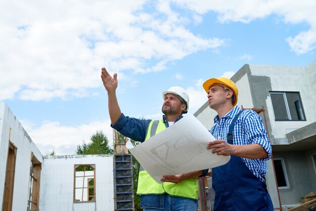 Foreman Checking Building Construction