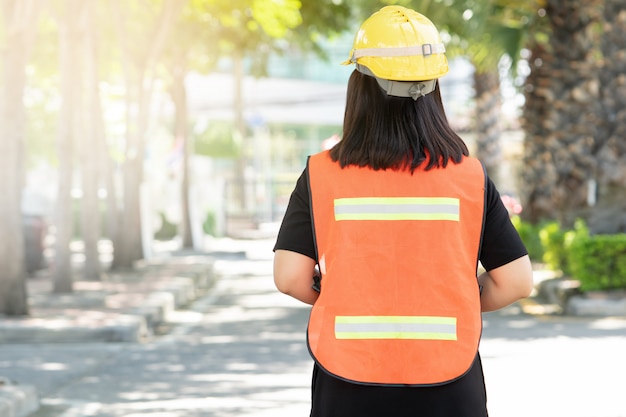 Foreman oversee construction work, wear reflective workwear for work safety. 