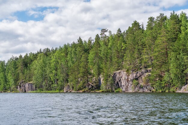 Forest lake with rocky shores