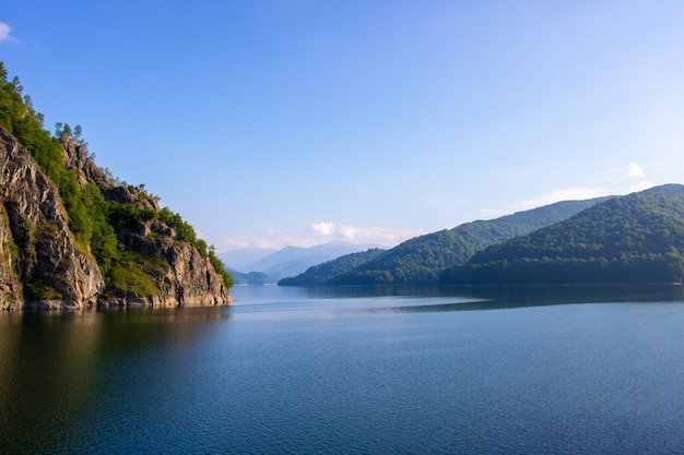 Forest and mountains above the lake. Transfagarasan