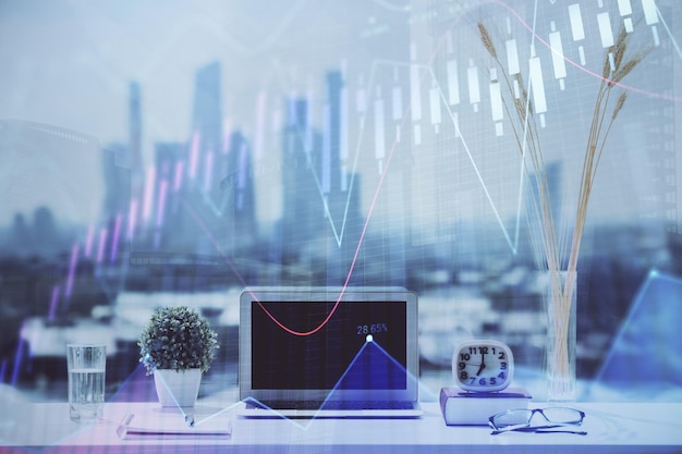 forex chart hologram on table with computer background multi exposure concept of financial markets